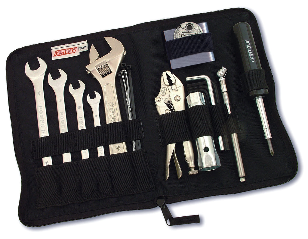 Cruztools Econokit M1 tool kit with various bike repair tools and accessories arranged in a compact case.