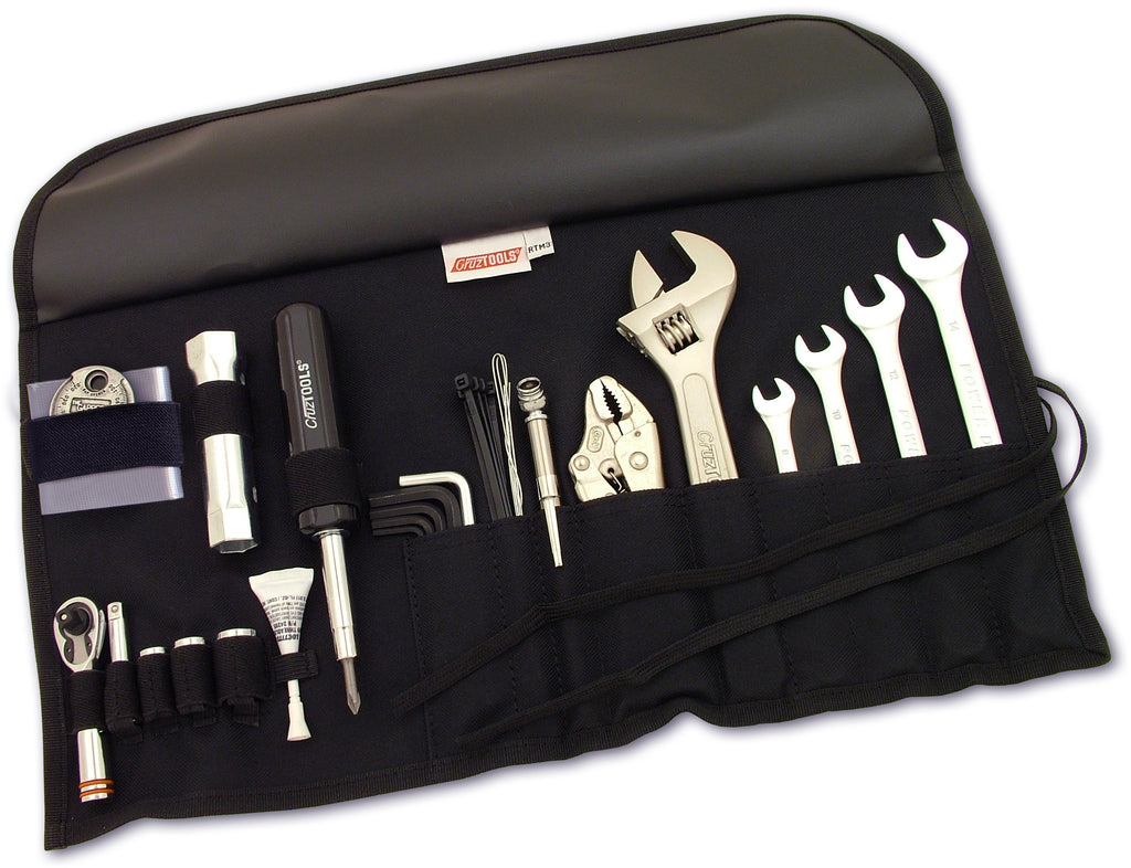 Cruztools Roadtech M3 Tool Kit with various motorcycle repair tools laid out on a surface.