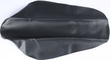 Load image into Gallery viewer, Black Cycle Works seat cover on a bike seat, showcasing its durable material and snug fit for comfortable riding.