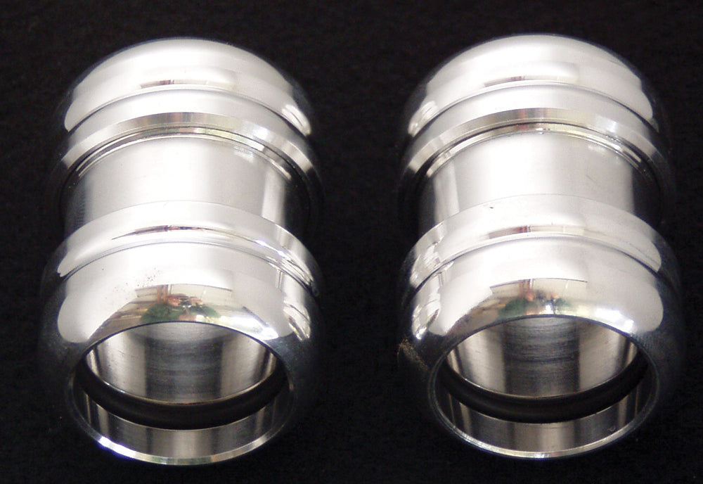 ModQuad universal exhaust clamp for 1 to 1-3/16 inch grooves, showing the metal clamp with grooved design on a plain background.