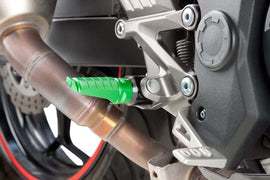 PUIG Racing Green footpegs for motorcycle foot controls, featuring durable metal construction with green finish for high-performance riding.