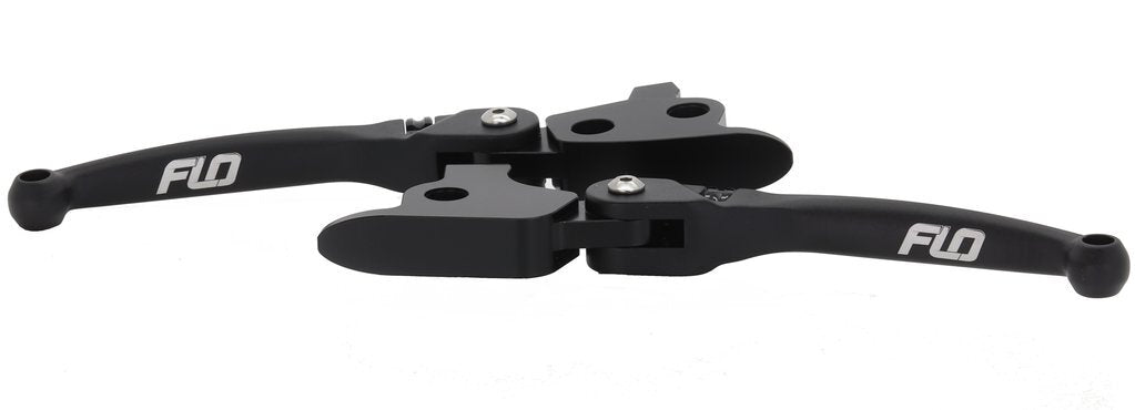 Flo Motorsports black MX style lever set for Harley Davidson FLH and FLT models 2008-2013, showing close-up of levers on motorcycle handlebars.