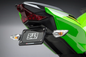 Yoshimura Fender Eliminator V2 Kit for Kawasaki motorcycle, showing sleek black body with mounting components.