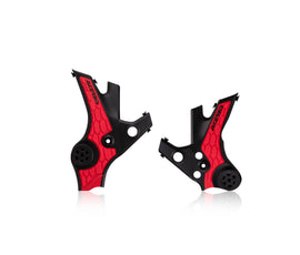 Acerbis X-Grip black and red motorcycle frame guard installed on a bike frame, showcasing durable protective design.