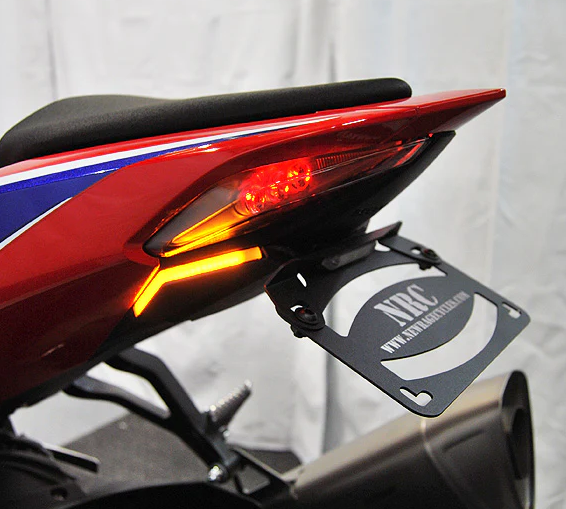 New Rage Cycles Fender Eliminator body part for motorcycles, showing the sleek black metal design and mounting hardware.