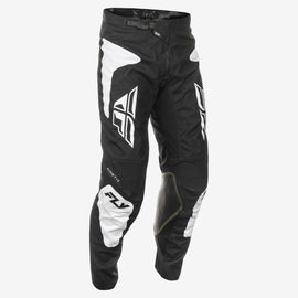 Fly Racing Kinetic Sym black and white motocross pants with reinforced knee areas, size 34, casual riding gear.