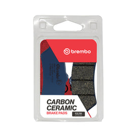 Brembo Prime Organic Brake Pads OEM organic brake pads with metal backing, shown in a close-up image.