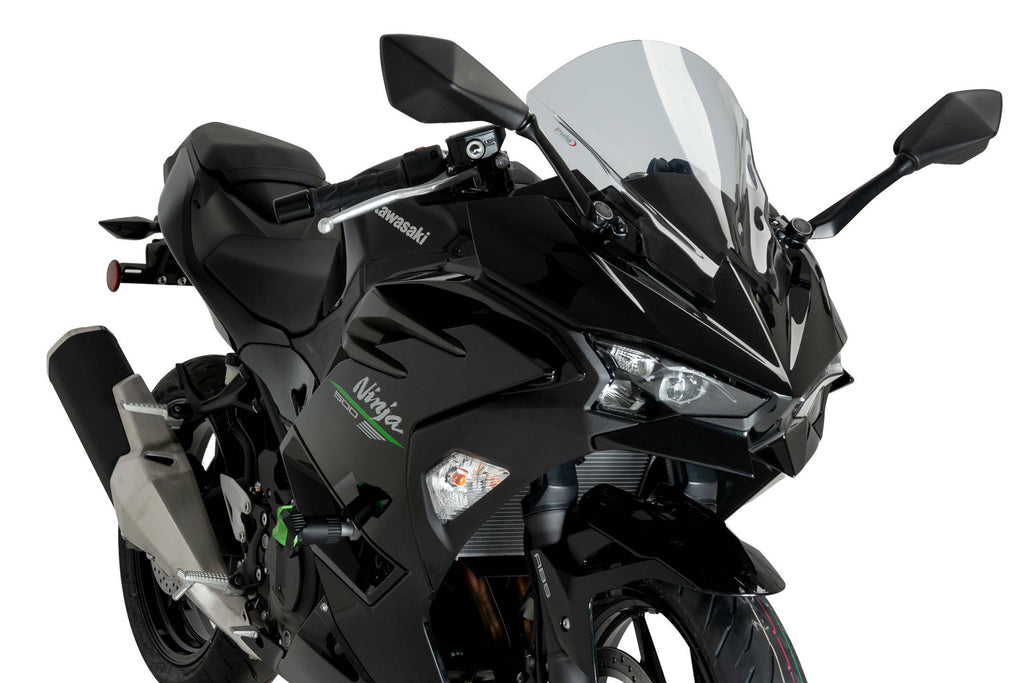 PUIG Z-Racing Smoke Windscreen for Kawasaki motorcycle, clear tinted windshield with aerodynamic design.