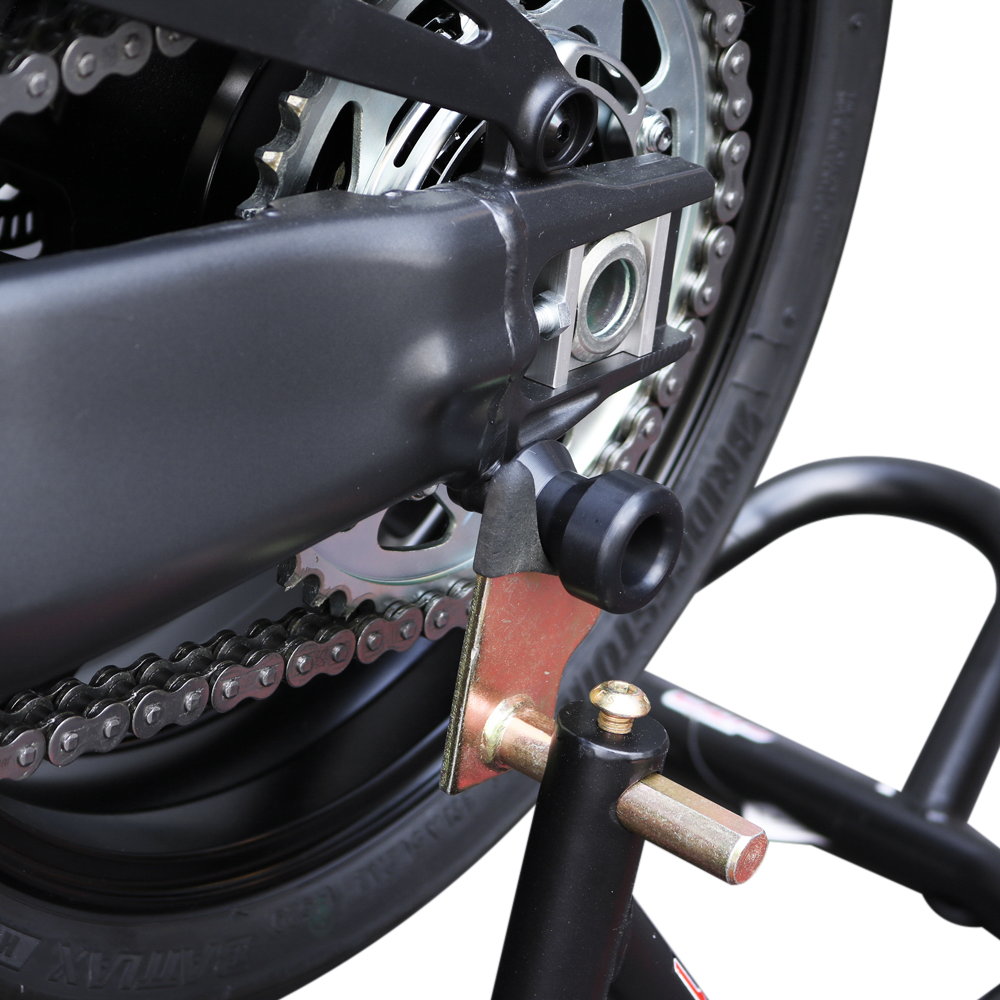 Black Shogun Industries swingarm sliders attached to a motorcycle's body, designed to protect the bike's swingarm during falls.