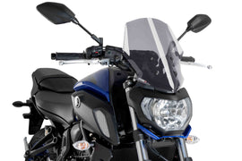 PUIG Naked New Generation Touring Smoke Windshield for motorcycle, featuring a sleek, tinted windscreen designed for touring riders.