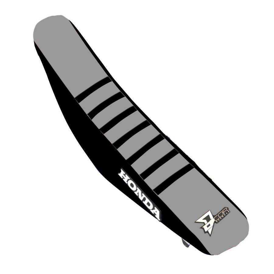 DCOR black and grey ribbed seat cover for CRF250/450 motorcycle, showing textured fabric and fitting details.