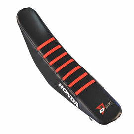DCOR black seat cover with red ribs, designed for automotive seats, featuring a durable fabric and stylish pattern.