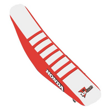 Load image into Gallery viewer, DCOR red and white ribbed seat cover for CRF250/450 motocross bikes, featuring durable material and vibrant color design.