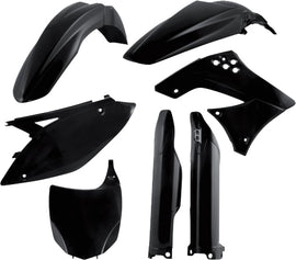 Acerbis black plastic kit, motorcycle or ATV replacement parts, with various black plastic components laid out on a surface.