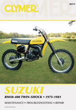 Load image into Gallery viewer, Clymer Suzuki RM50 repair manual with tools, featuring detailed pages and illustrations for motorcycle maintenance.