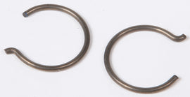Vertex piston circlips for Vertex pistons, durable metal clips used in piston assembly, shown in this close-up image.