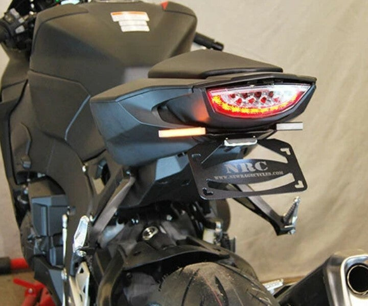 New Rage Cycles Fender Eliminator body for HON motorcycles, showcasing sleek black design and mounting components.