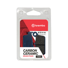 Load image into Gallery viewer, Brembo Prime CC carbon ceramic brake pads with metallic backing plates, shown in black and silver, designed for high-performance braking.