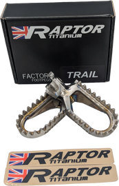 RAPTOR titanium foot pegs for advanced Honda motorcycle foot controls, featuring durable metal construction and a sleek design.
