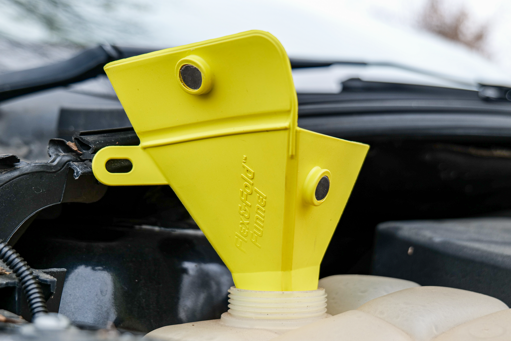 Small blue Caliber Flex & Fold Funnel accessory with flexible and foldable design, ideal for precise liquid transfer.