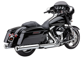 Cobra 4-inch NH slip-on exhaust with chrome finish installed on Indian motorcycle, showcasing sleek metal design and branding.