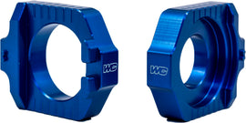 WORKS Axle Blocks Elite KTM and Husqvarna drive accessories, showing durable black metal design for motorcycle wheel stability.