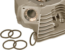 James Gasket exhaust gasket set with square-shaped twin cam and Evo gaskets, showing multiple black rubber seals and metal components.
