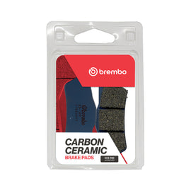 Brembo Prime Tt brake pads carbon ceramic with metallic backing, designed for high-performance brake system, visible in the image.