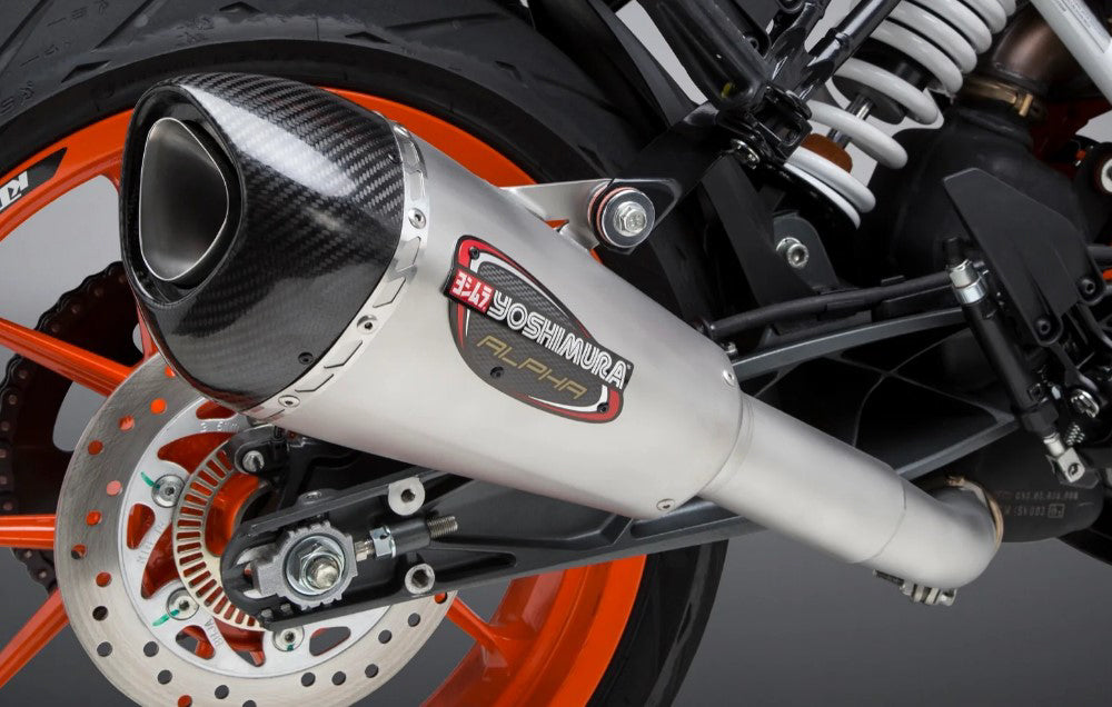 Yoshimura Street Alpha-T slip-on exhaust in stainless steel with carbon fiber end cap, designed for motorcycle performance.