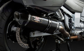 Yoshimura R-77 slip-on exhaust for motorcycles, featuring stainless steel and carbon fiber finish, with dual outlets.