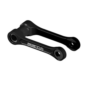 ZETA adjustable lowering link in black for Kawasaki suspension, shown in a close-up view with mounting points visible.