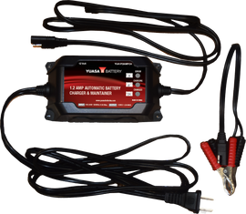 Yuasa 1.2 Amp 12V charger and maintainer for batteries, shown with charging cables and battery connection clips.