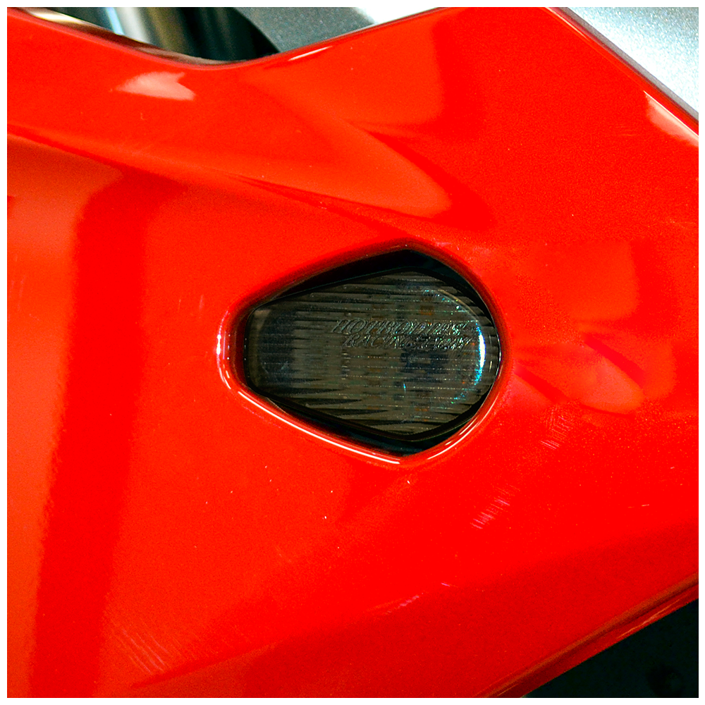 Hotbodies Racing flush mount signal light in smoke, featuring sleek design and clear lens for motorcycle or vehicle signaling.
