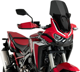 PUIG Touring Dark Smoke Windscreen for motorcycle, showing the tinted, curved windshield with mounting points.