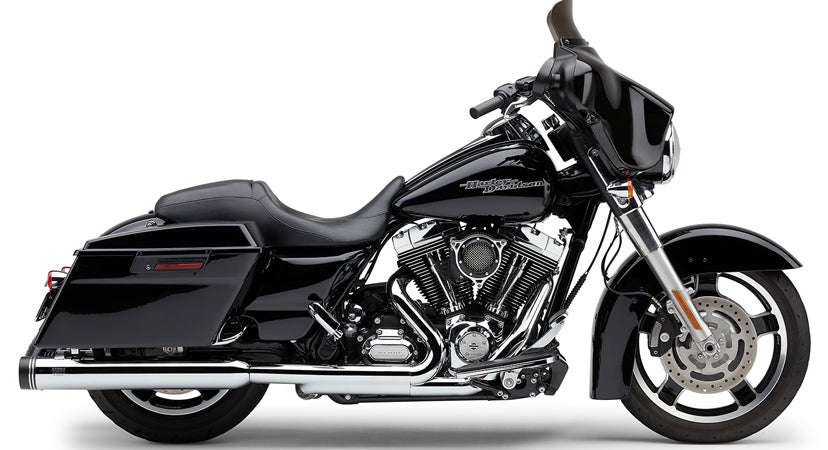 Cobra 4-inch chrome groove tip exhaust slip-on for Harley FLH and FLT models, showcasing polished chrome finish and slip-on design.