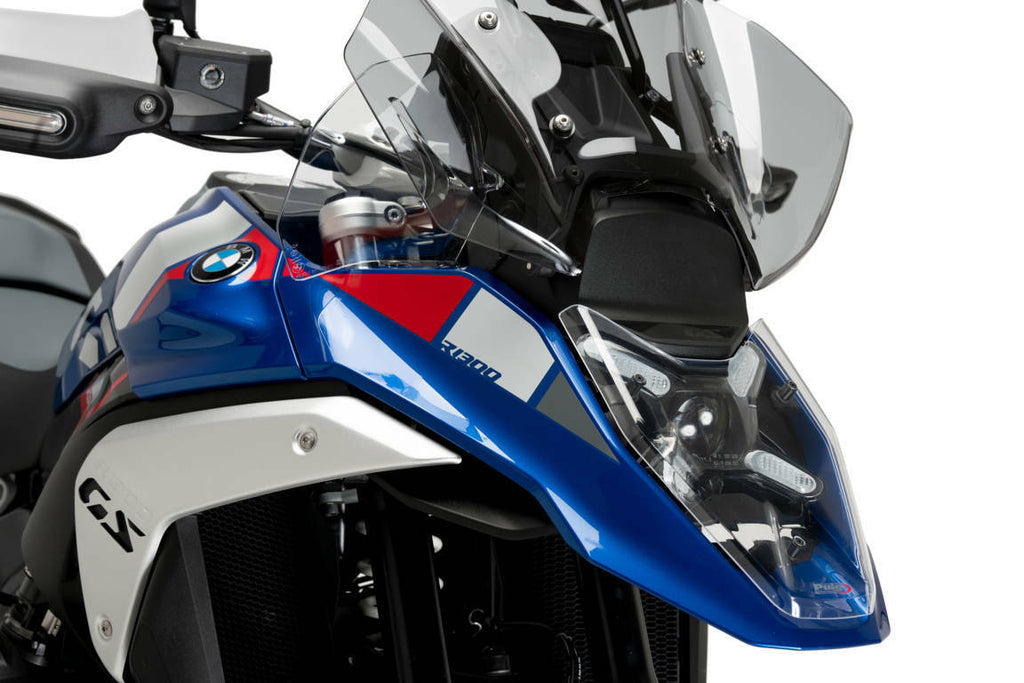 Clear Puig headlight protector for BMW, providing a durable shield for vehicle headlights.