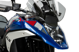 Clear Puig headlight protector for BMW, providing a durable shield for vehicle headlights.