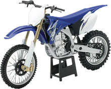 Load image into Gallery viewer, Detailed view of a New Ray Toys 1:12 scale Yamaha YZ450F 2009 die-cast replica motorcycle model with realistic features.