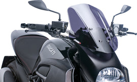 PUIG Naked New Gen touring dark smoke windshield for motorcycle, showing sleek tinted windscreen with mounting edges