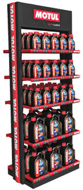 Large Motul display rack featuring various Motul products for late summer showcases organized automotive lubricants and accessories.