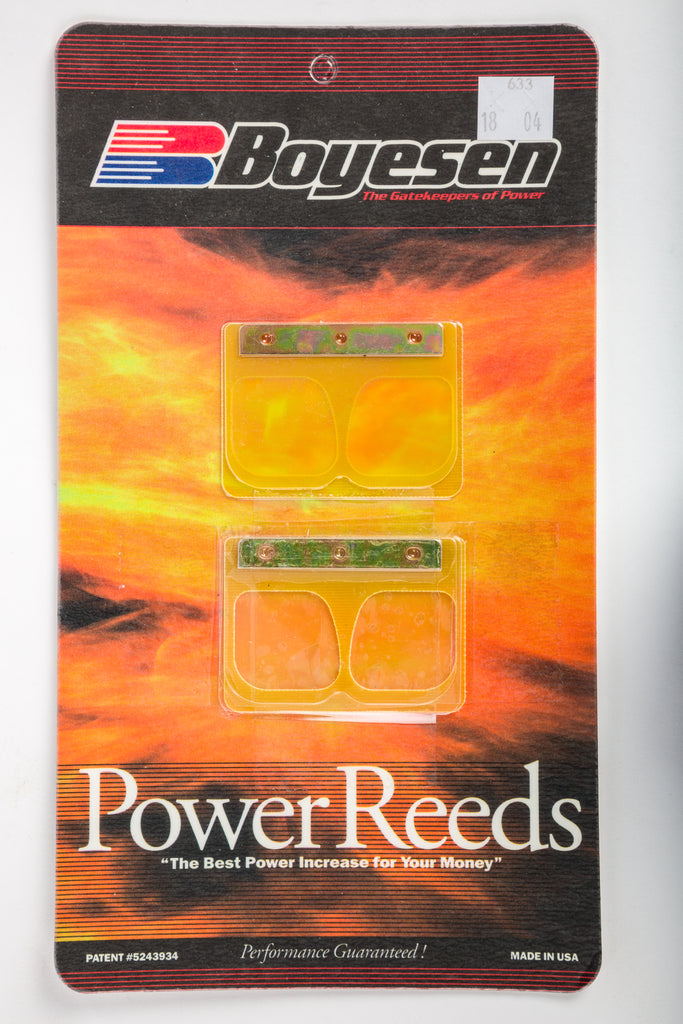 Boyesen motorcycle intake reeds 59-7633 installed in carburetor, showcasing durable reed valves for improved fuel system performance