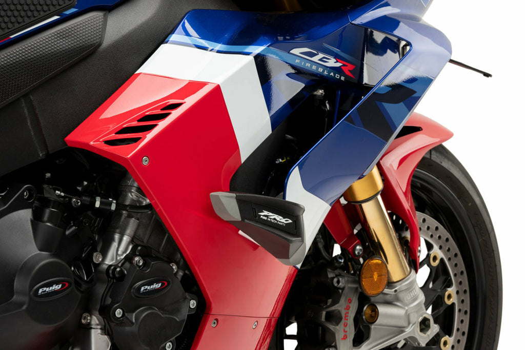 PUIG Frame Sliders Pro 2.0 in black, mounted on a motorcycle, showcasing durable protective motorcycle accessories.
