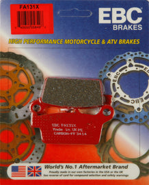 EBC Motorcycle Brakes Brake Pads 15-131X set showing four brake pads with metal backing plates and friction surfaces.