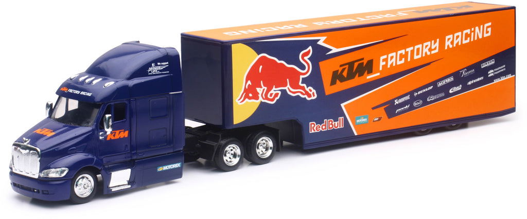 Red Bull KTM race truck replica by New Ray Toys, detailed 1:43 semi truck model with vibrant red and racing decals.