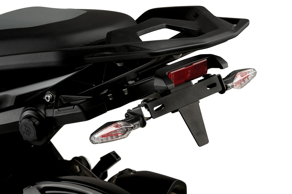 Black PUIG Fender Eliminator Kit for BMW motorcycle, sleek body component with mounting hardware, designed for a clean look.