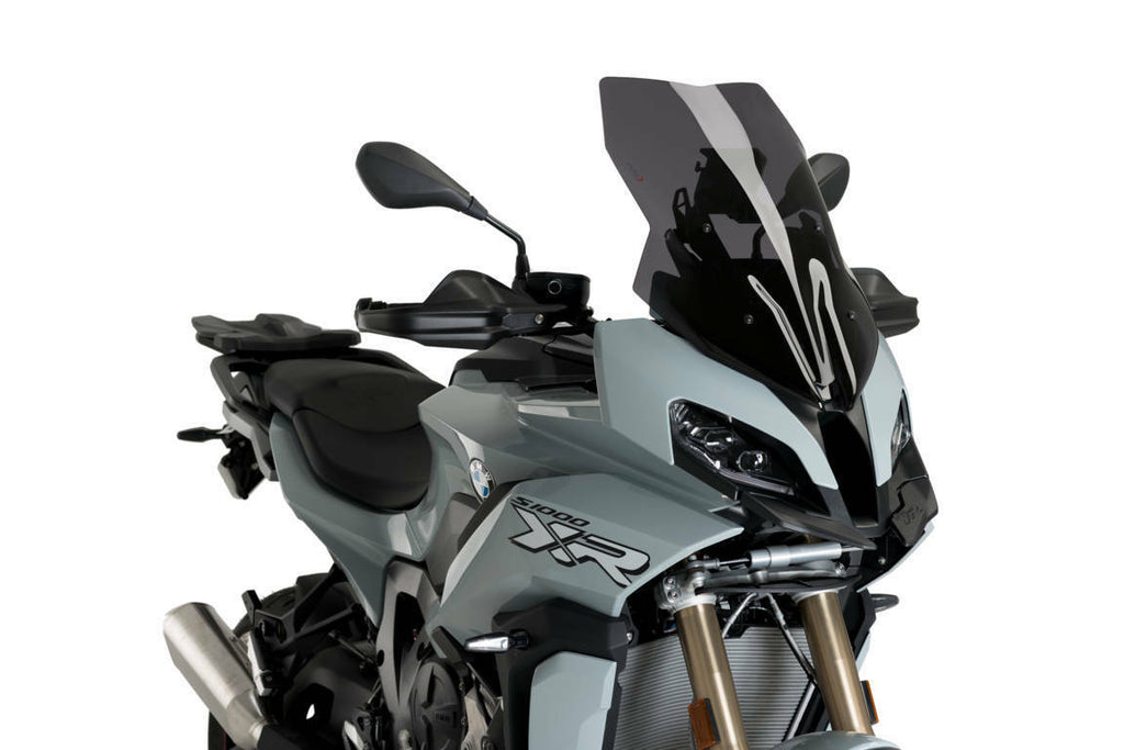 PUIG dark smoke touring motorcycle windshield for BMW, showing the tinted, curved windscreen mounted on a bike.