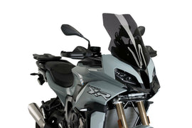 PUIG dark smoke touring motorcycle windshield for BMW, showing the tinted, curved windscreen mounted on a bike.