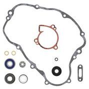 Vertex water pump rebuild kit for engine, including gaskets and seals, shown on a workbench with engine components.