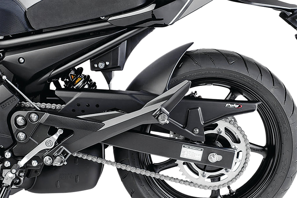 PUIG matte black tire hugger for motorcycle body, showing sleek, curved design and mounting points on a black background.
