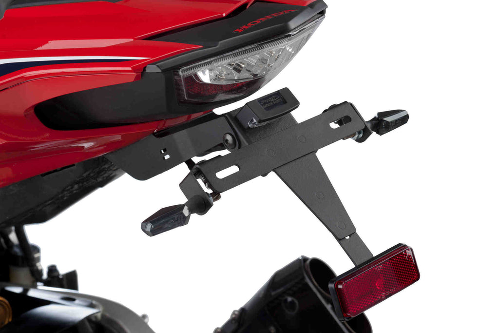 Black PUIG Fender Eliminator Kit for motorcycle, showcases sleek body design with mounting brackets and streamlined profile.